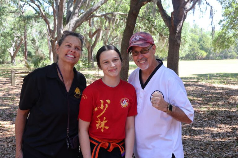 Grandmaster James Theros with teen student